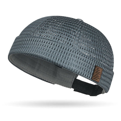 Breathable mesh cap with an adjustable strap